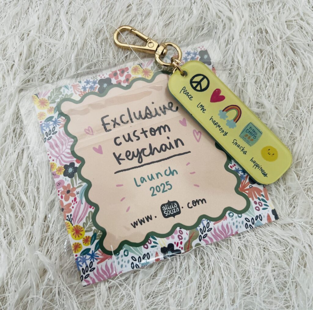 Lost in the World of Alicia Souza: A Planner Lover's Journey - Exclusive Custom Keychain - TheMemoryBites